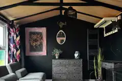 Winnie cabin interior with two sofa beds and storage