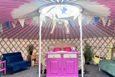 Carousel yurt with king sized bed, singles, and sofa beds