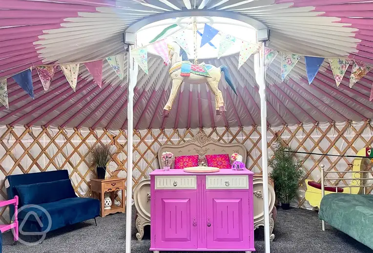 Carousel yurt with king sized bed, singles, and sofa beds