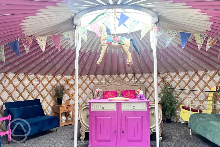 Carousel yurt with king sized bed, singles, and sofa beds