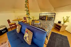 Screech Belle interior with a king size bed and a sofa bed 