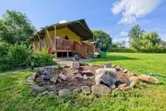 Safari tent and fire pit area at Little North Field