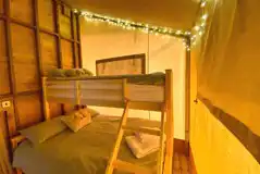 Safari tent triple bunk bedroom with fairy lights