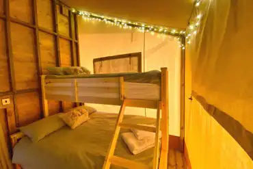 Safari tent triple bunk bedroom with fairy lights