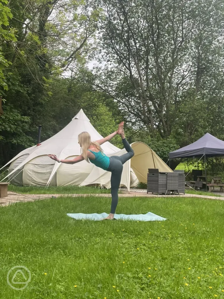 Yoga outside Barn Owl bell tent