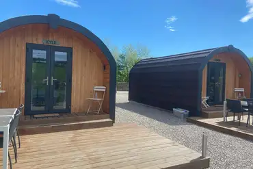 Pods with private decking areas at Ardgay Glamping Pods