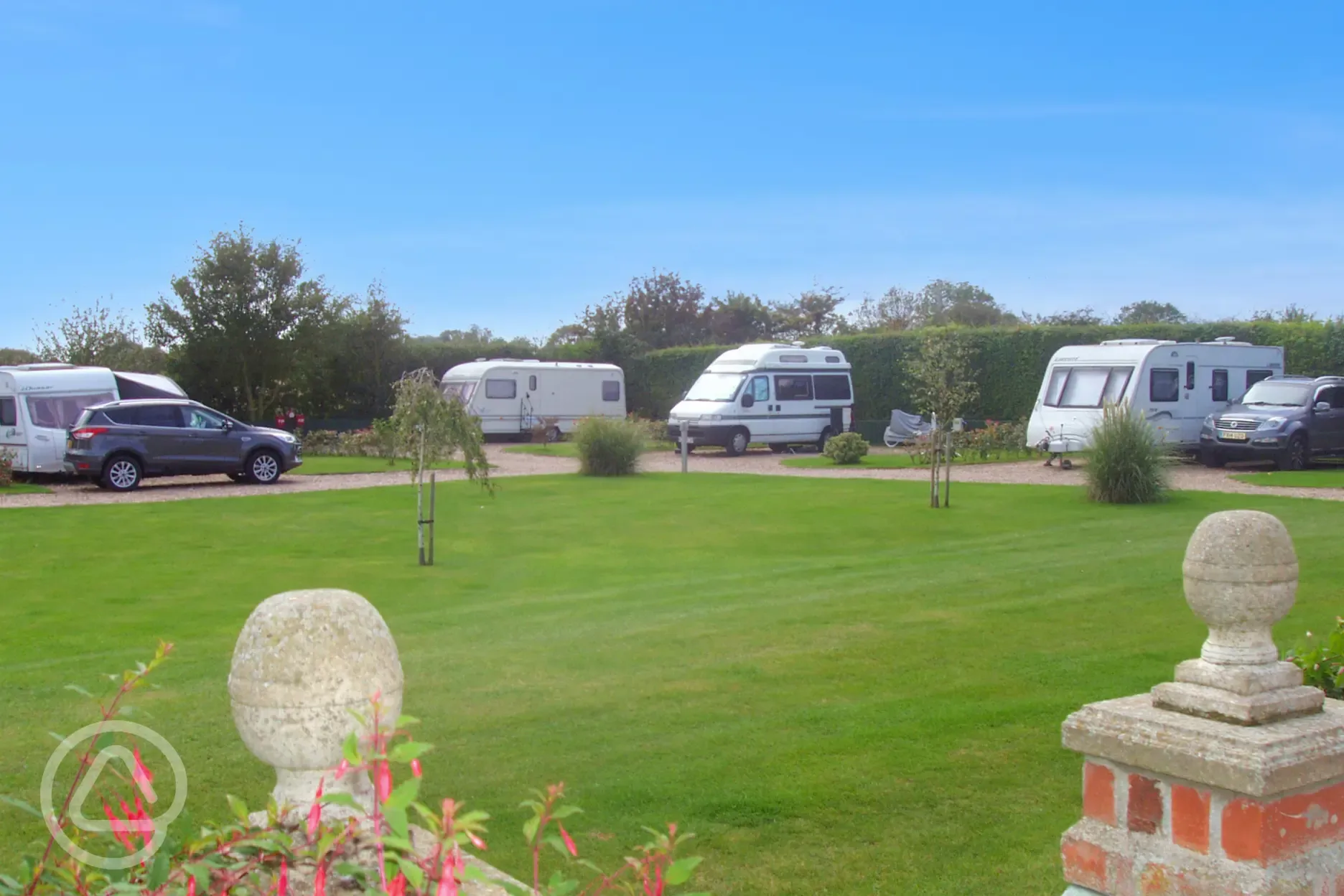 Electric hardstanding pitches with landscaped grounds