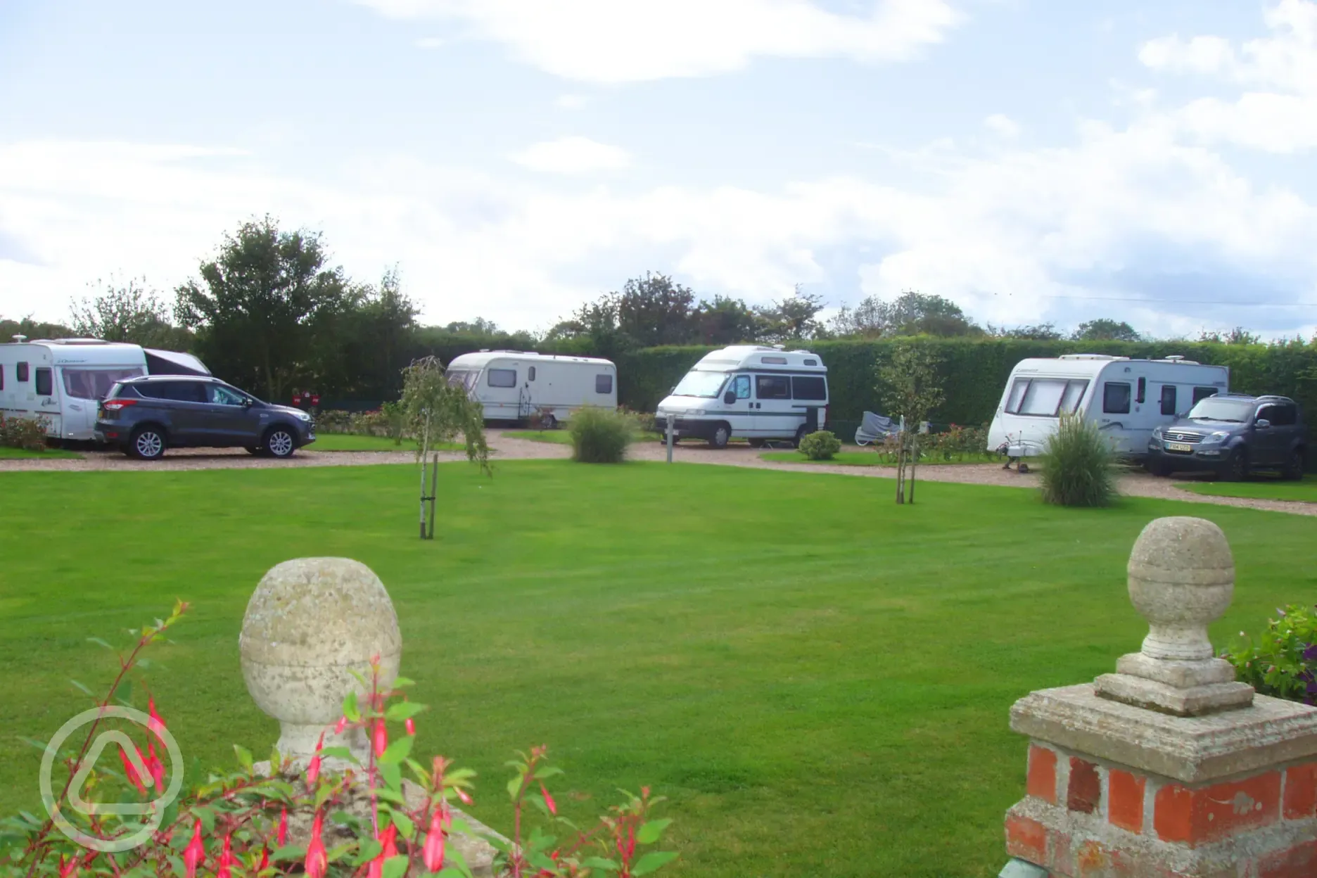 Electric hardstanding pitches with landscaped grounds
