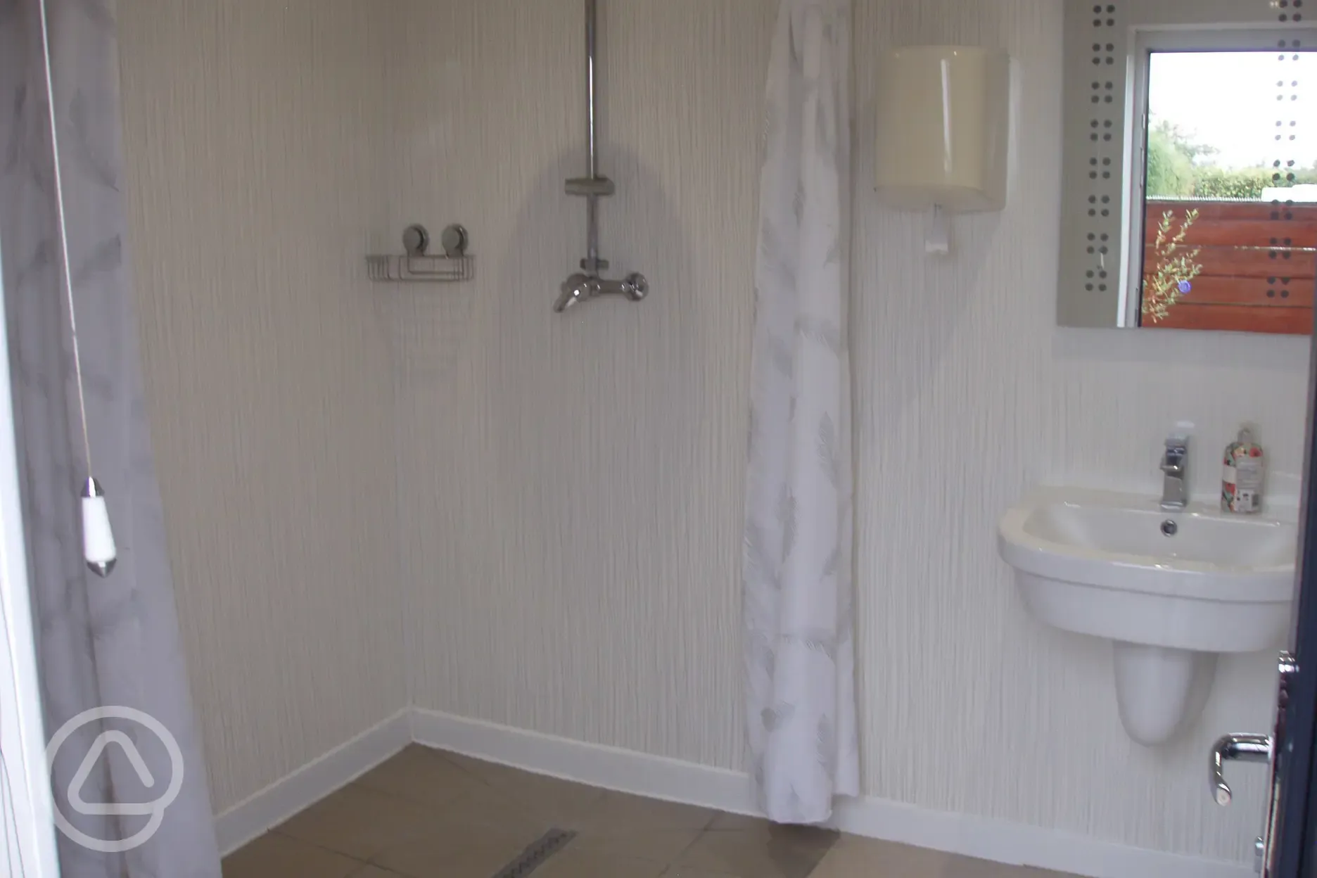 Heated shower room with mirror and sink