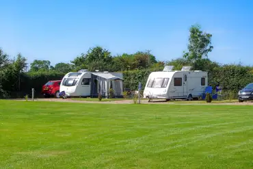 Electric hardstanding pitches at Pear Tree Cottage at Poplar Farm