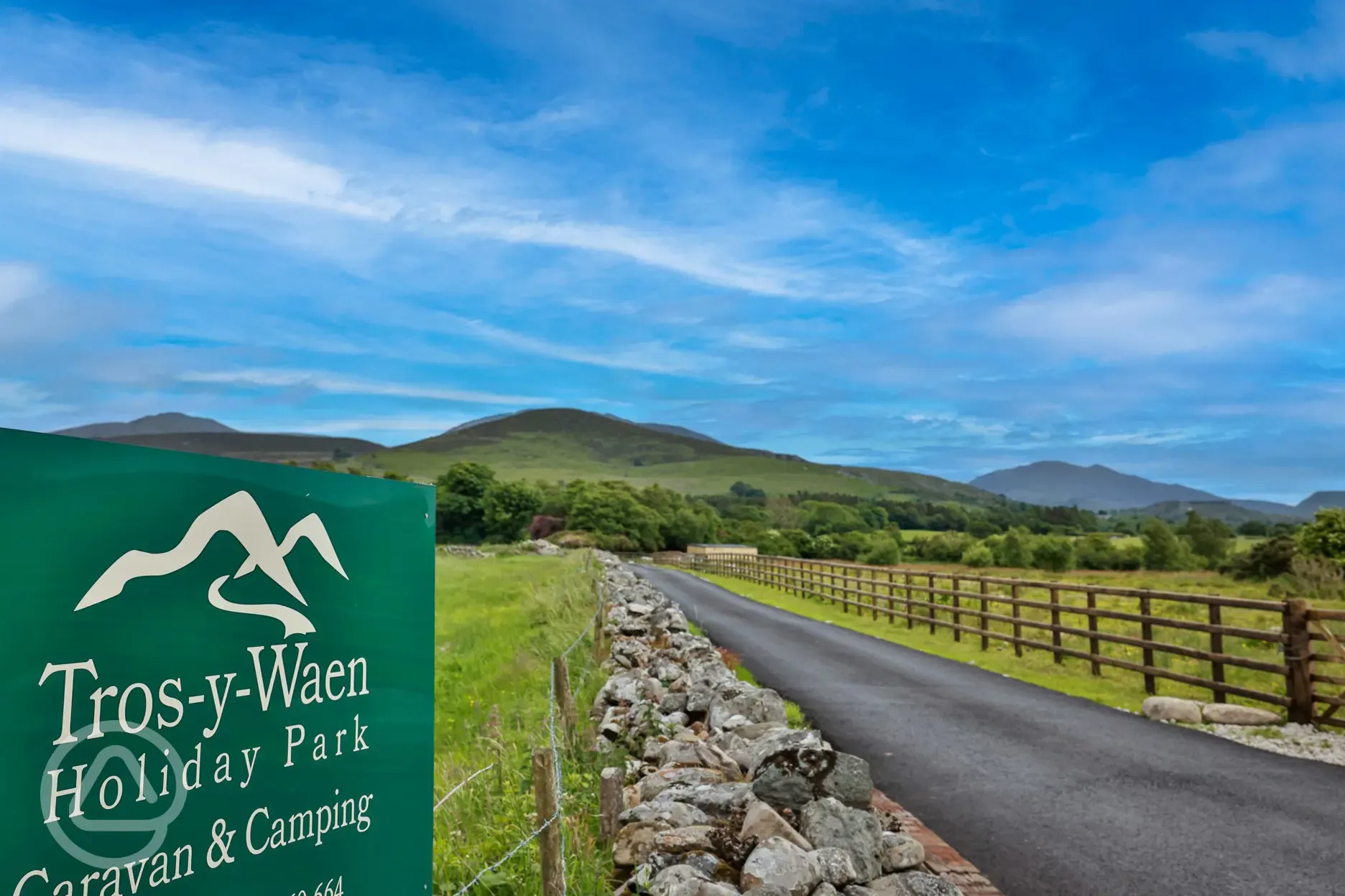 Entrance to Tros Y Waen Holiday Park with Snowdon behind