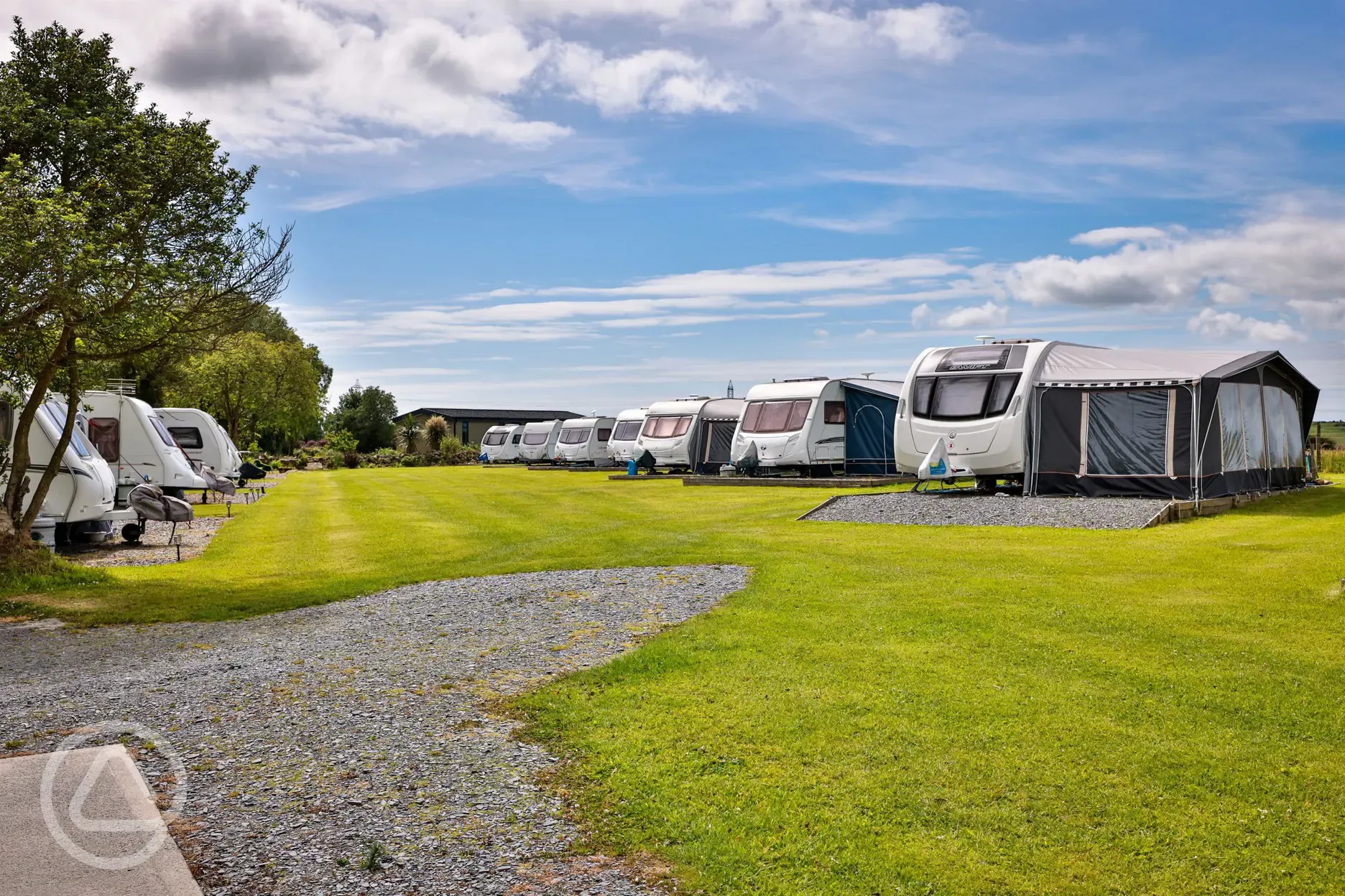 Electric hardstanding pitches with caravans and awnings