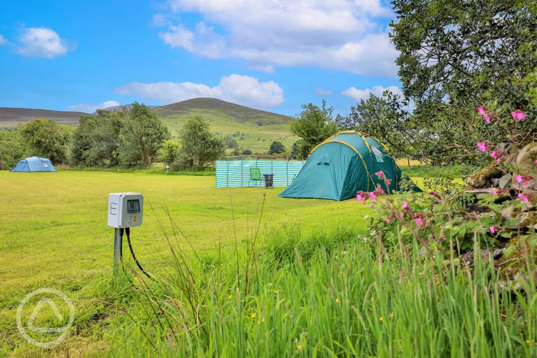 Tent on an electric grass tent pitch with 10amp electric hook up