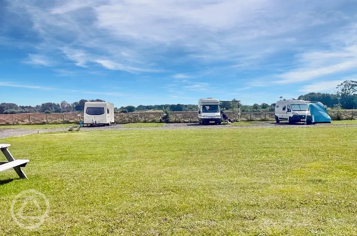 Electric hardstanding and grass pitches