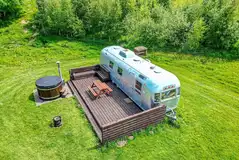 Big Bertha Airstream caravan with a wood-fired hot tub and deck area Big Bertha Airstream caravan with a wood-fired hot tub and deck area