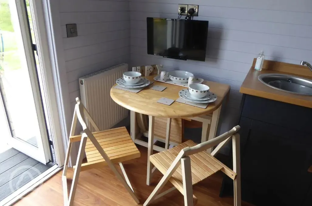Ensuite glamping pod dining table and chairs
