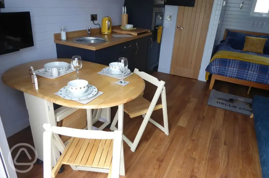 Ensuite glamping pod dining table and chairs