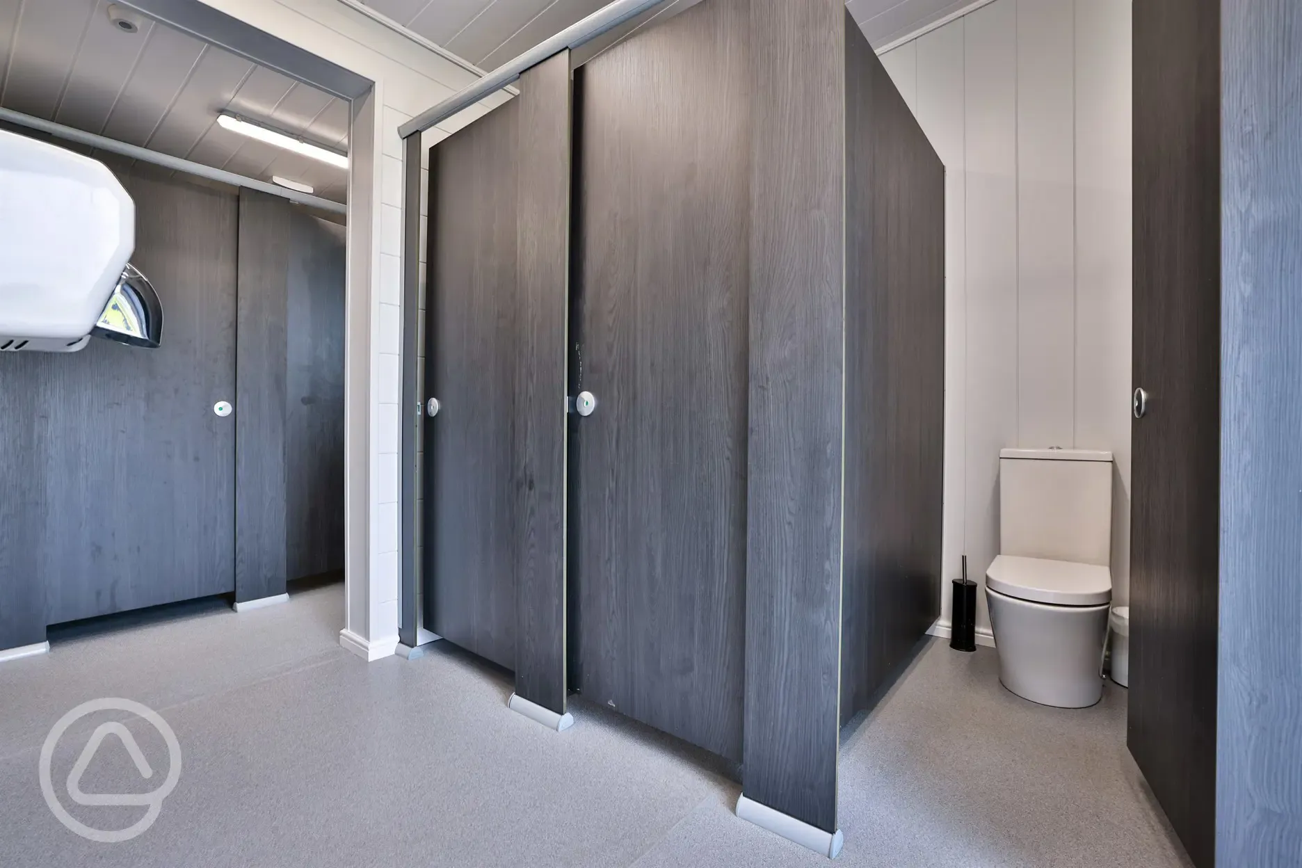 Toilet cubicles with hand dryers