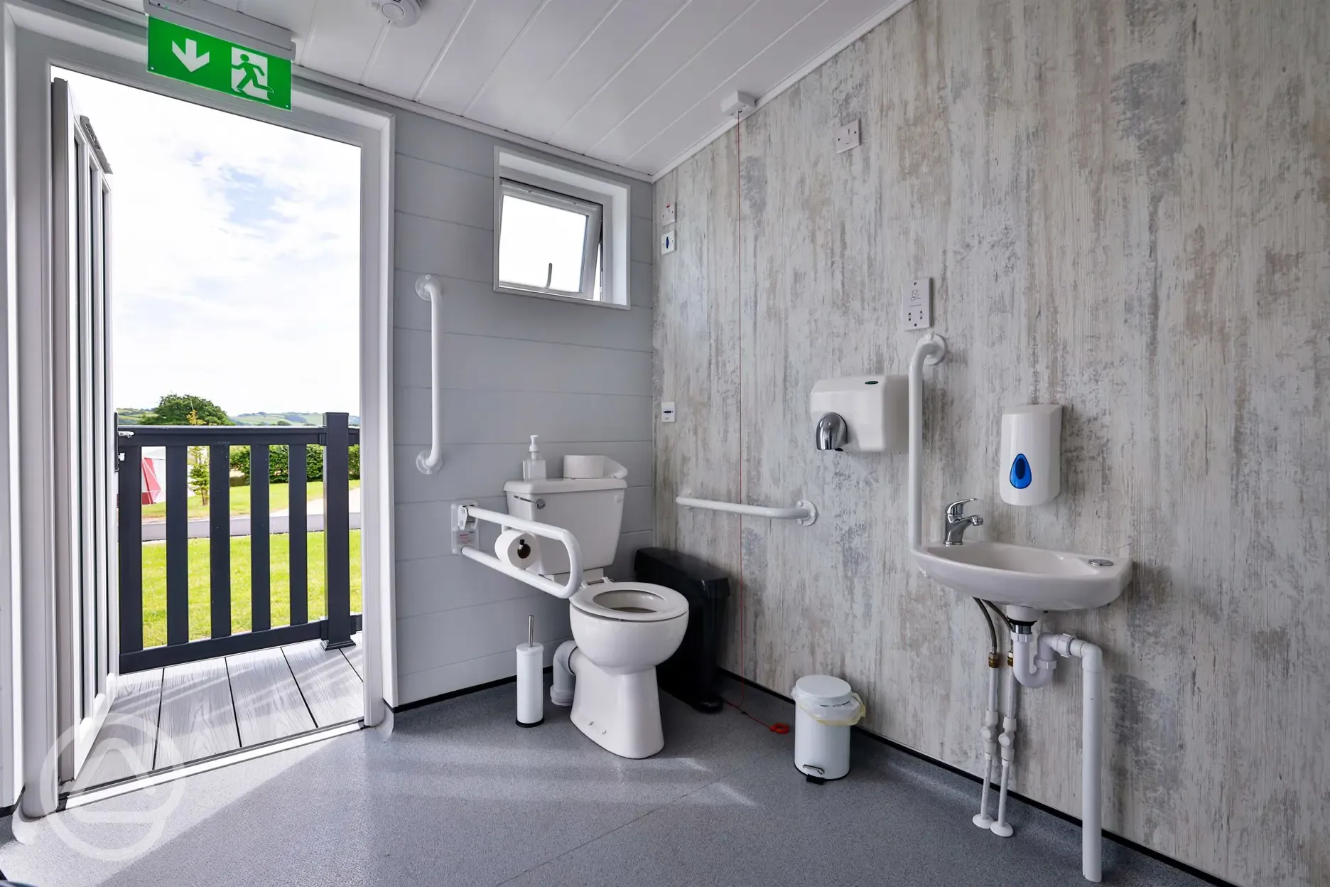 Disabled bathroom with accessible toilet and sink