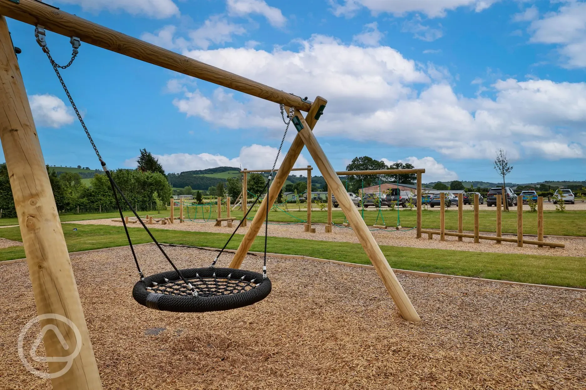 Play area with swing and assault course