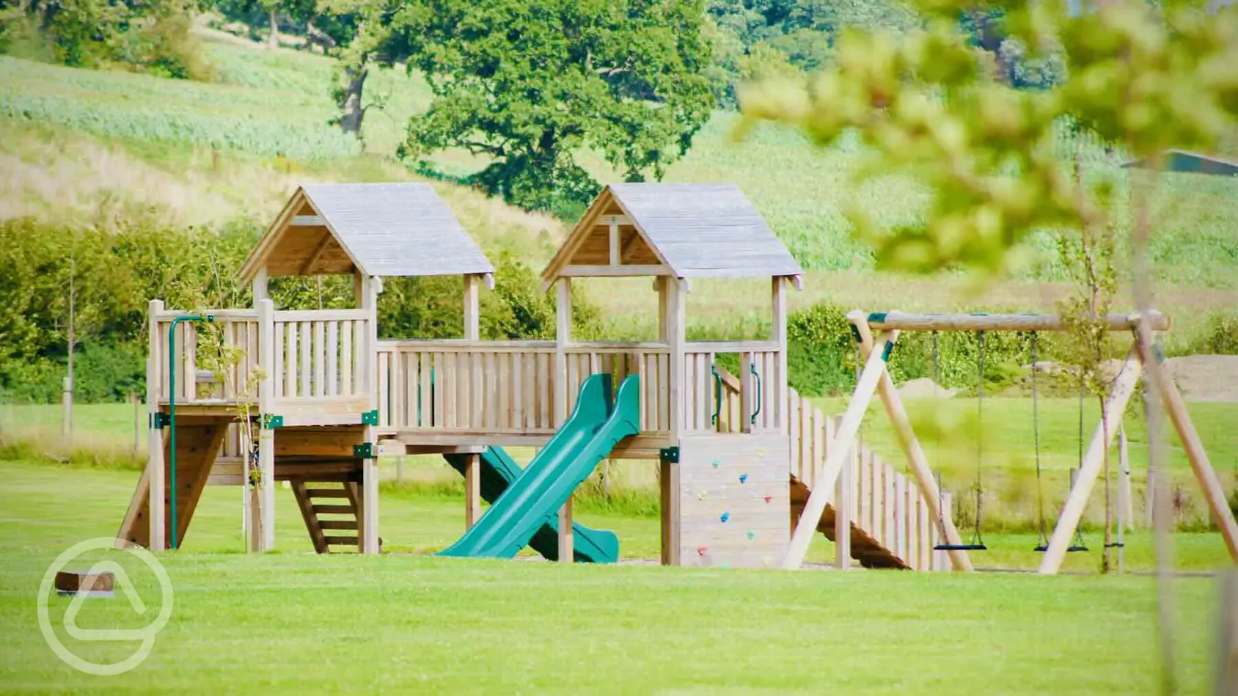 Play area with swings, slides and climbing frame