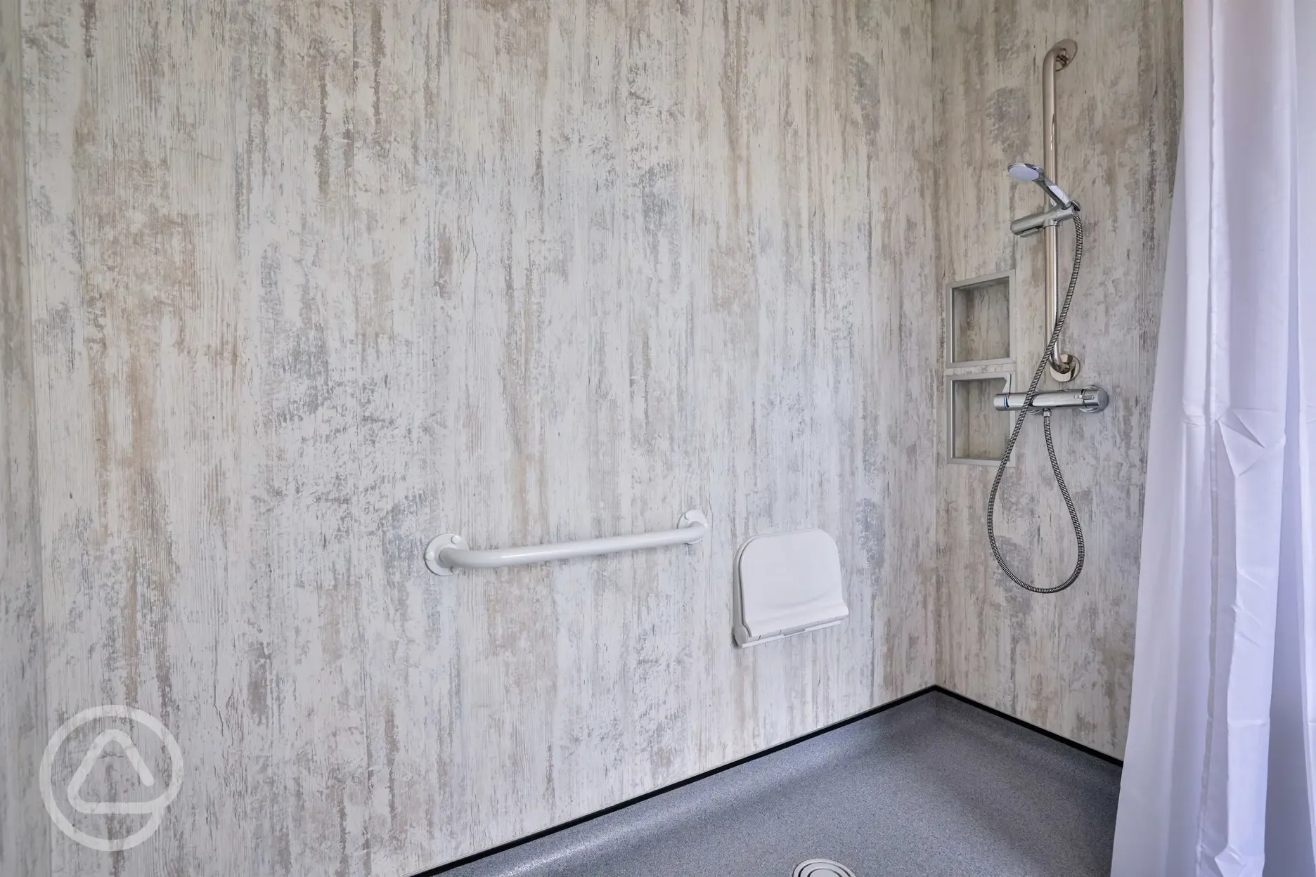 Disabled bathroom with shower with handrails