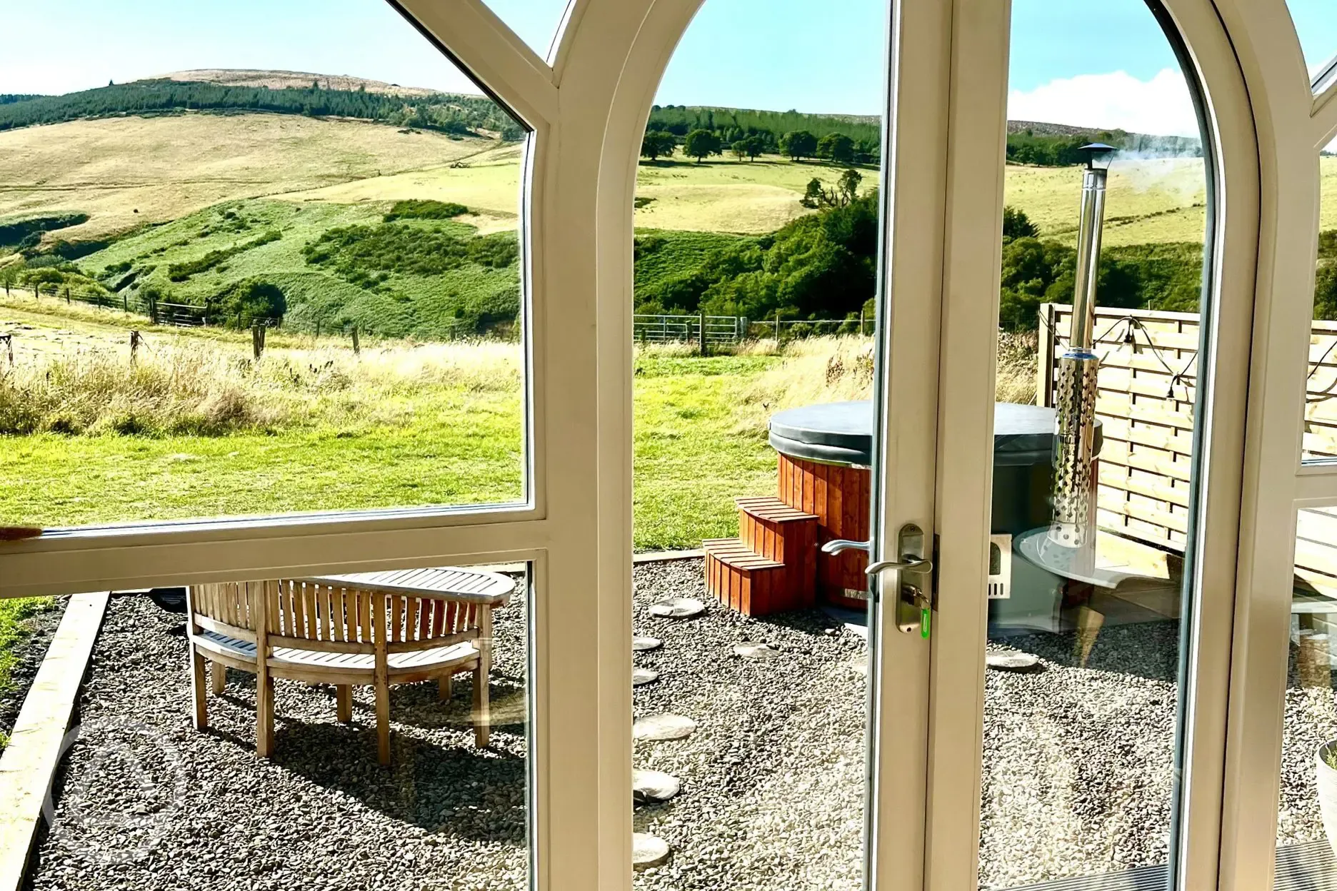 Heather ensuite pod views and wood-fired hot tub with outdoor seating