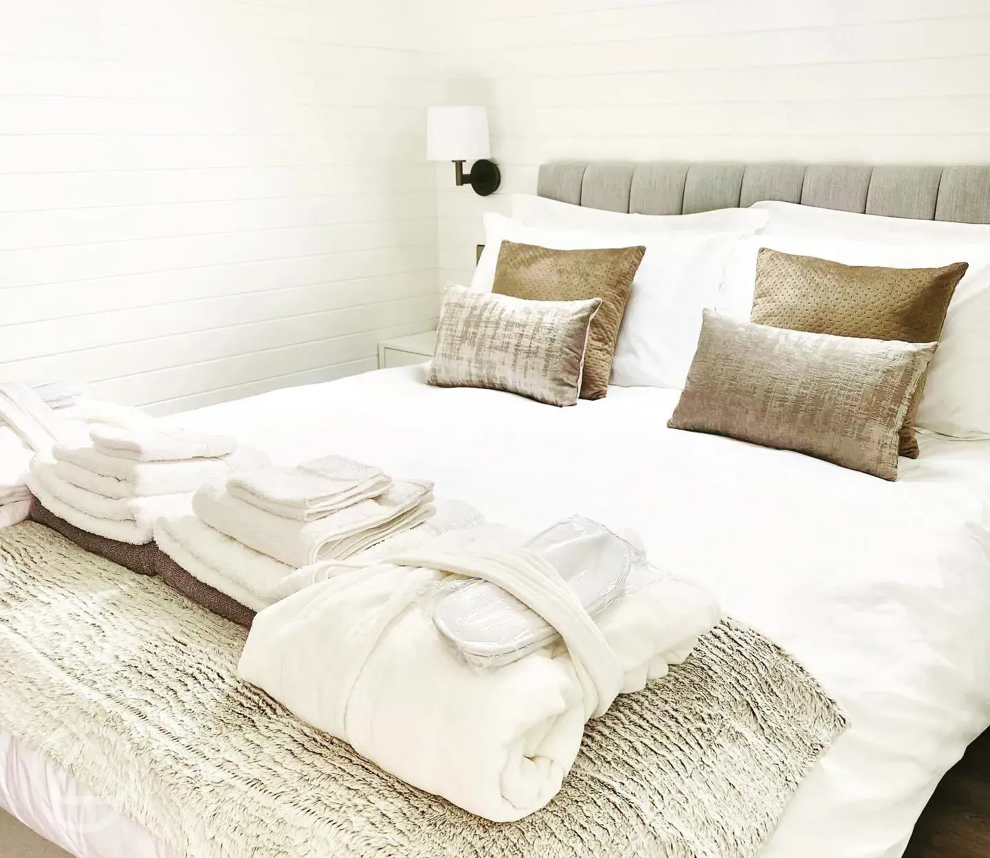 White Clover ensuite pod king size bed with towels, robes, and slippers provided