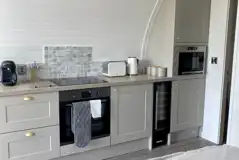 White Clover ensuite pod kitchen area with oven, microwave, toaster, and kettle White Clover ensuite pod kitchen area with oven, microwave, toaster, and kettle