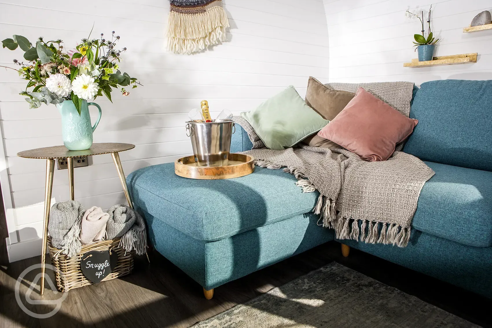 White Clover ensuite pod sofa bed with blankets and special occasion prosecco