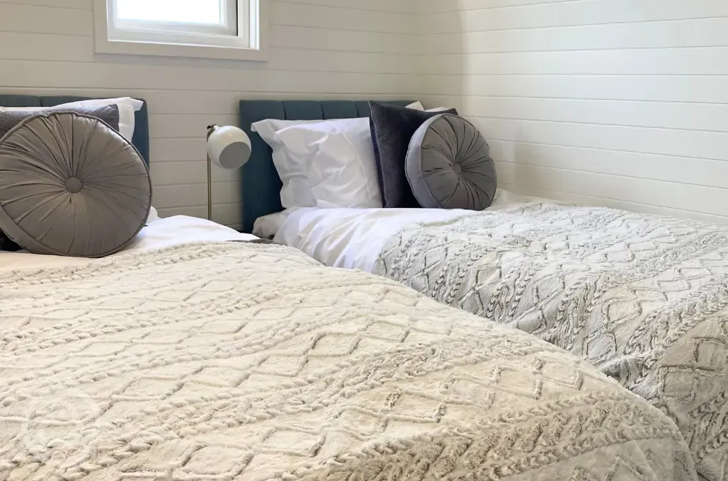 White Clover ensuite pod twin beds in a separate room (bedding provided)