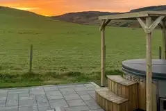 White Clover ensuite pod wood-fired hot tub overlooking sunset White Clover ensuite pod wood-fired hot tub overlooking sunset
