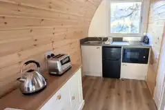 Accessible ensuite glamping pod with a fully equipped kitchenette