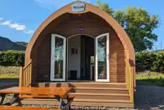 View of the family sized ensuite glamping pods with picnic bench