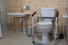 Toilet with grab rails in the accessible ensuite toilet