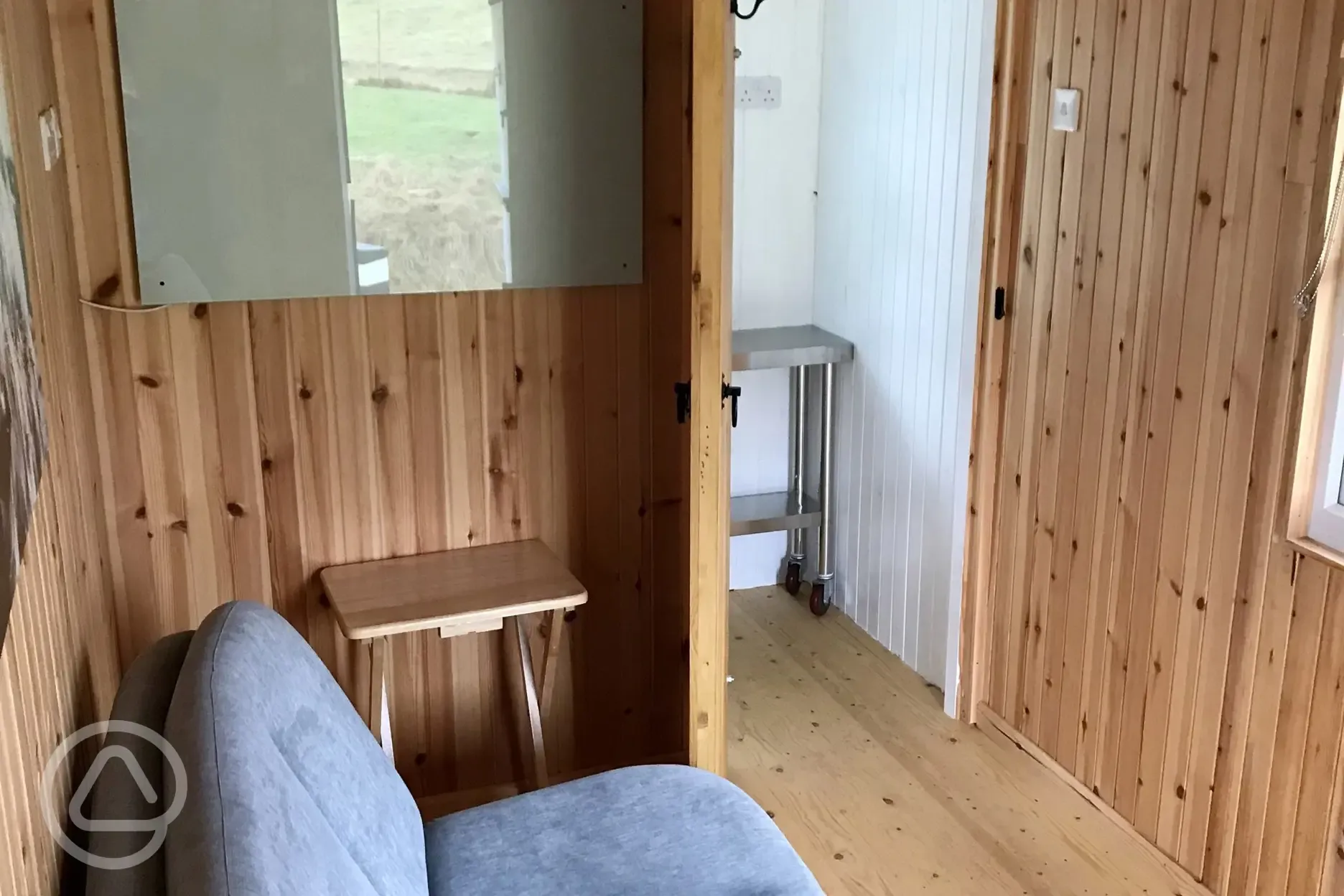Shepherds hut - interior with sofa bed and panel heater