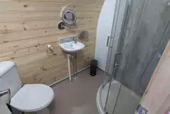 Family sized glamping pods ensuite with shower, toilet, and sink