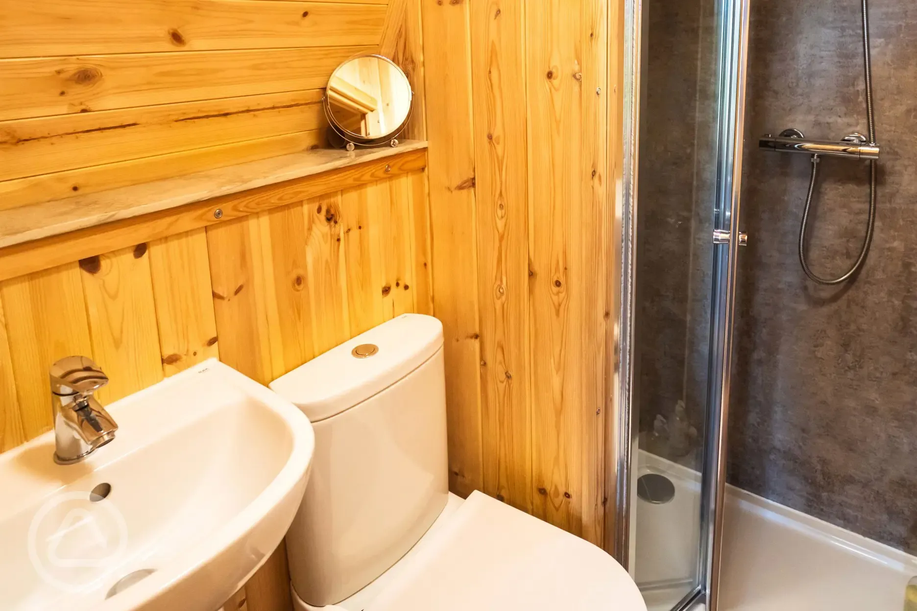 Chimpanzee large ensuite glamping pod bathroom with toilet, shower and sink