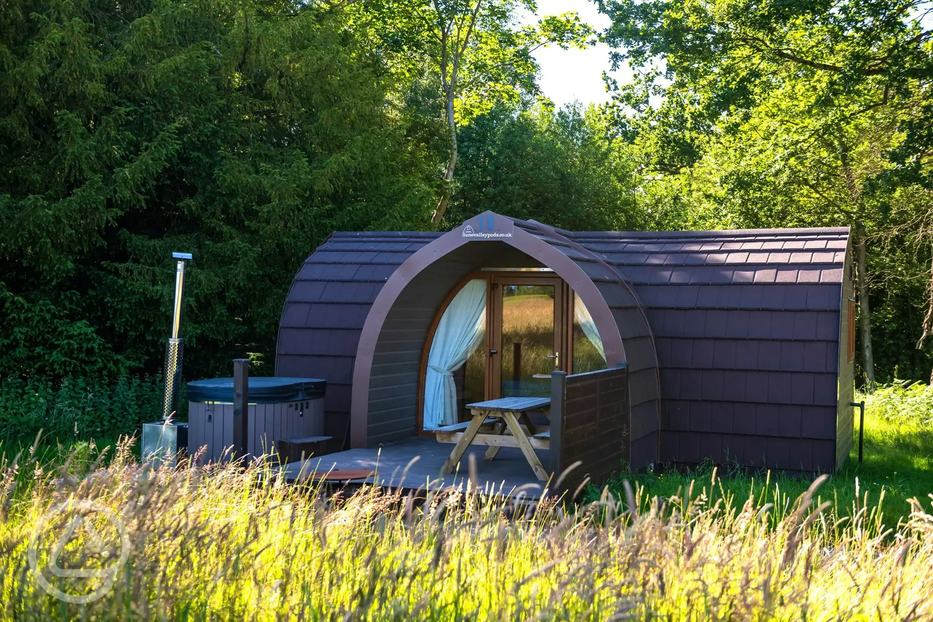 Primate pod with outdoor seating and hot tub