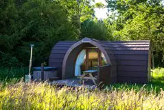 Primate pod with outdoor seating and hot tub