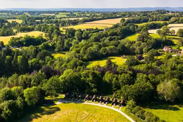 Aerial of the glamping pods at Missing Link Glamping in countryside surroundings
