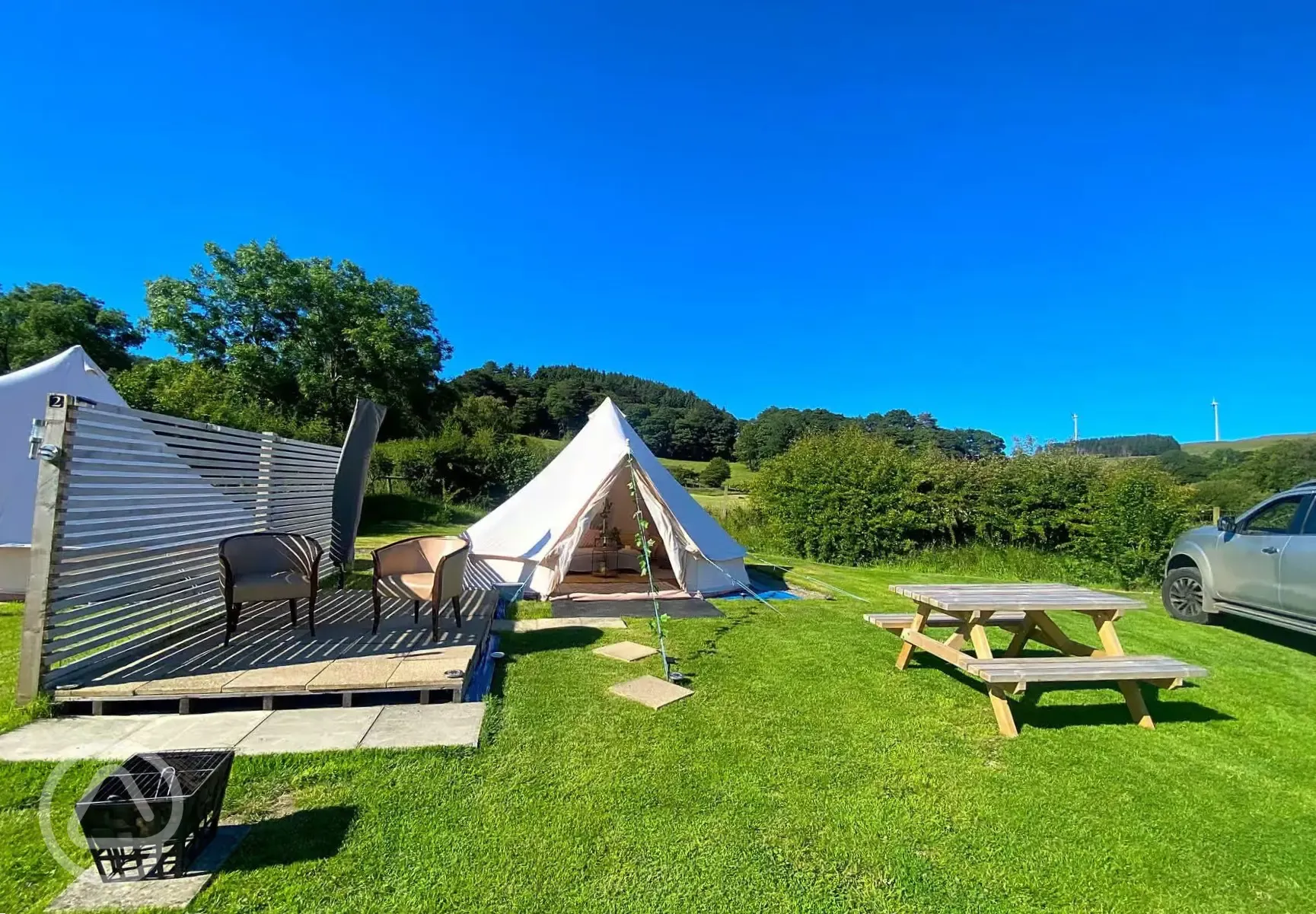 Bell tent outdoor seating and fire pit