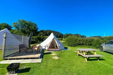 Bell tent outdoor seating and fire pit