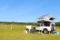 Non electric grass pitches with roof tents welcome