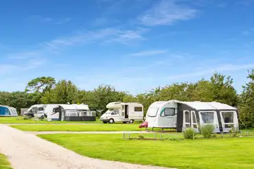 Fully serviced hardstanding pitches (7m x 10m) at The Nurseries Caravan Park 