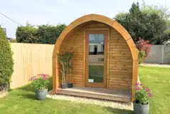 Camping pod with a small garden area