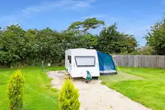 Fully serviced hardstanding pitches with space for awning Fully serviced hardstanding pitches with space for awning