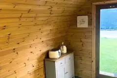Camping pod interior with a kettle and toaster