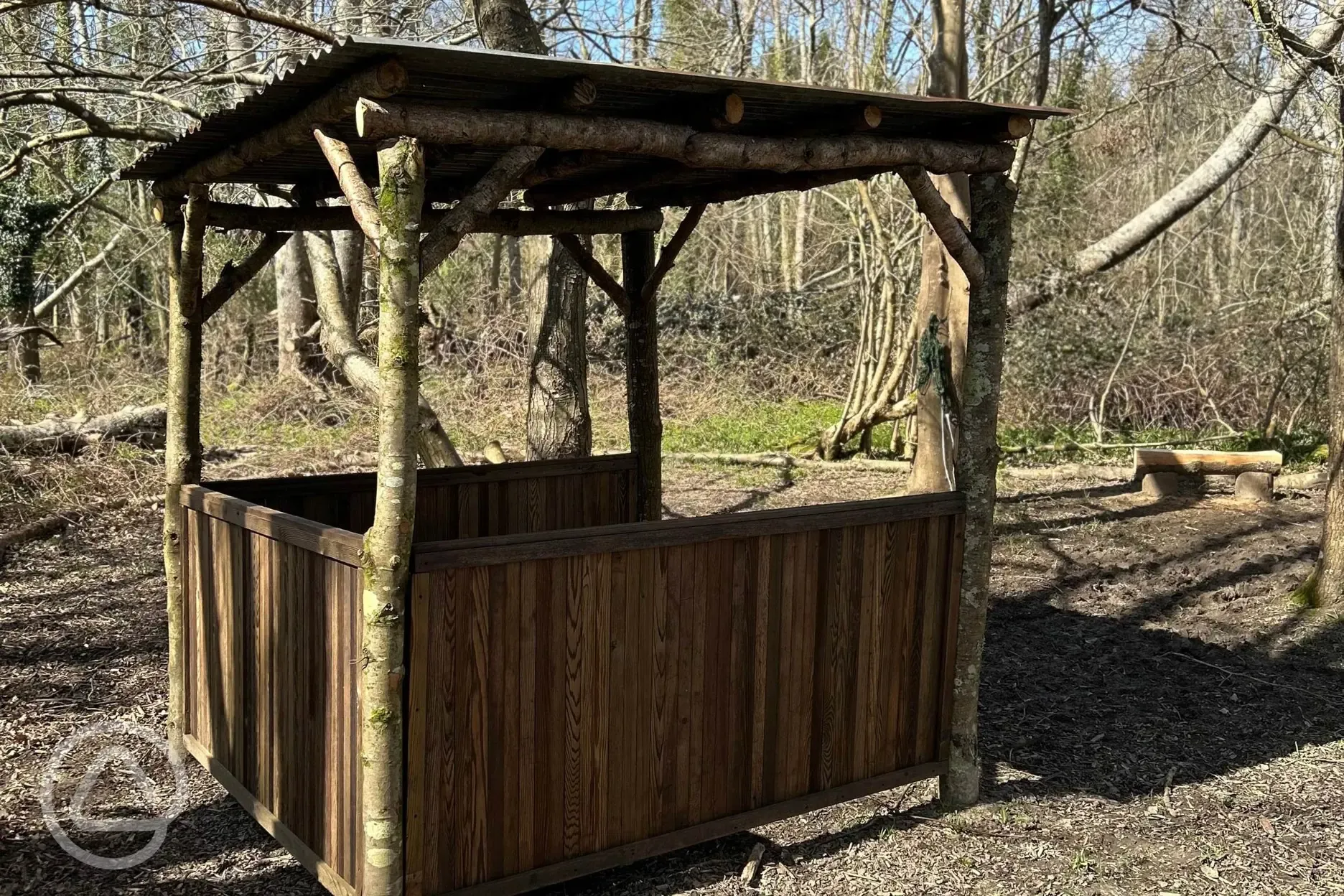 The Badgers Burrow glamping cabin outdoor covered seating 
