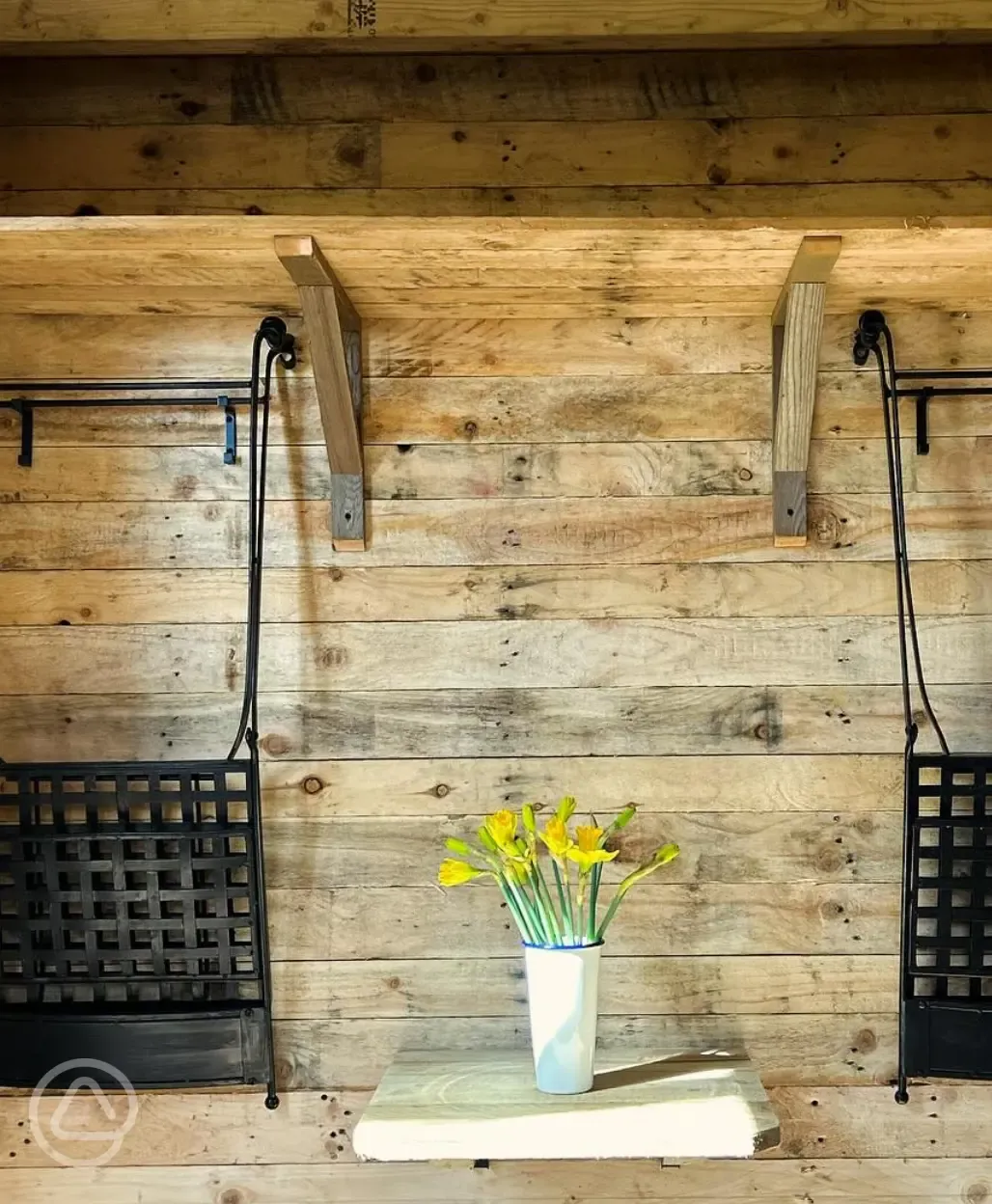 The Badgers Burrow glamping cabin interior dining area
